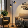 Lampadaire liseuse deux spots orientables, noir et doré – Bidart, vue d’ambiance