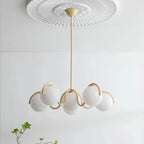 Suspension 6 globes opalins à bras ondulés – Antibes dans un intérieur