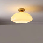 Plafonnier coupole en verre orange ou crème – Belleville dans un intérieur