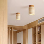 Plafonnier en travertin et bois, six formes – Goult dans un intérieur