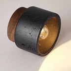 Plafonnier cylindre effet pierre de lave noire et noyer – Agde allumé