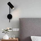 Applique liseuse cylindre orientable, dorée ou noire – Sablons dans un intérieur