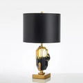 Panicale, lampe à poser verre ambré et noir sur socle doré
