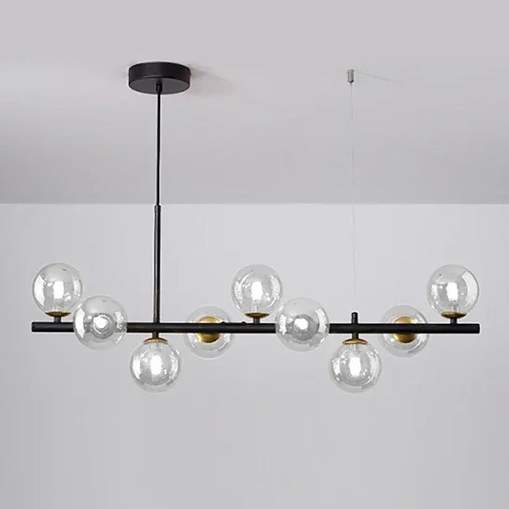 Suspension linéaire à globes de verre, noire ou dorée – Varenna, finition noir, verre transparent / 7 globes, L 65 cm